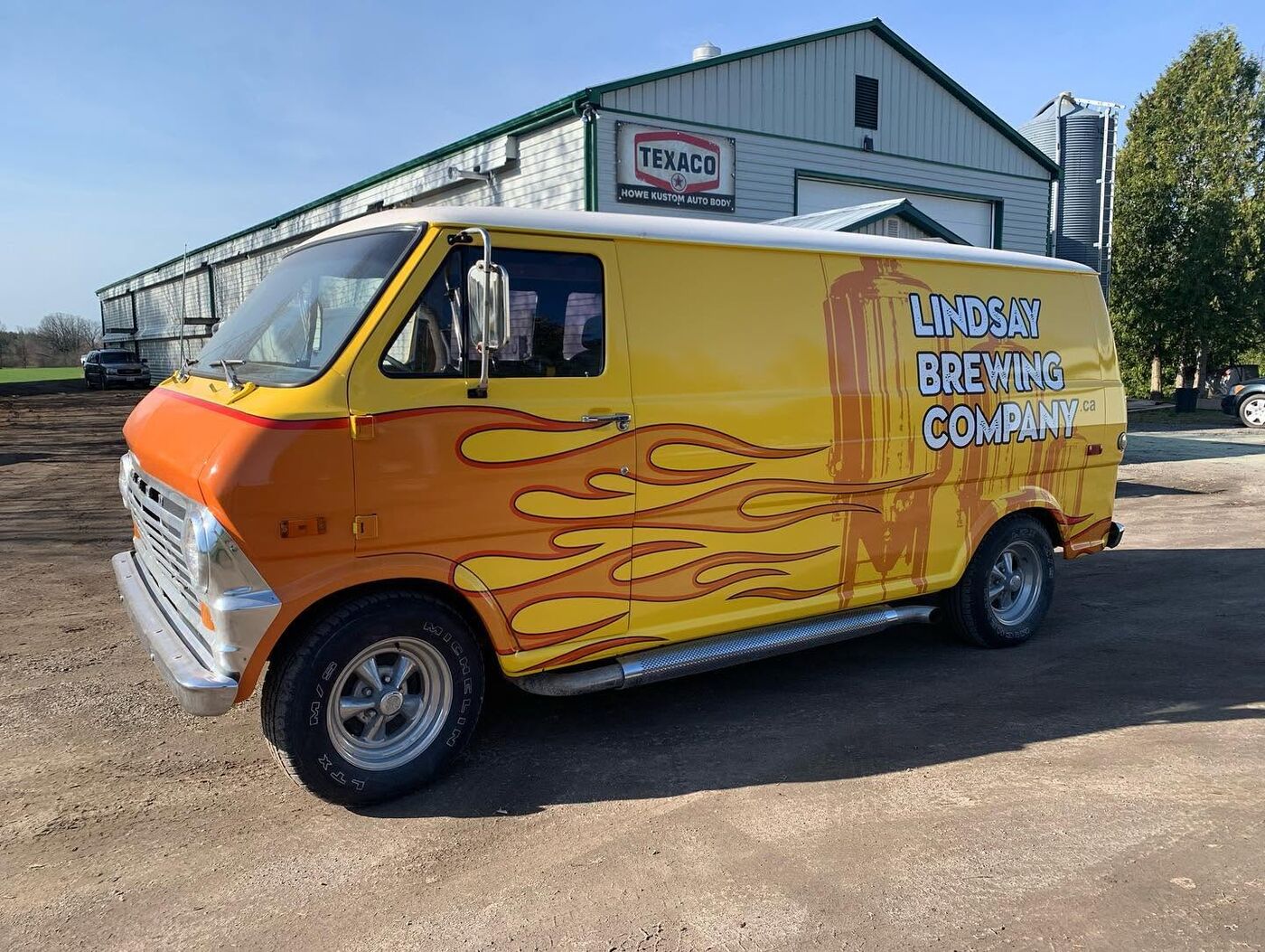Yellow custom van with flame paint for Lindsay Brewing Company